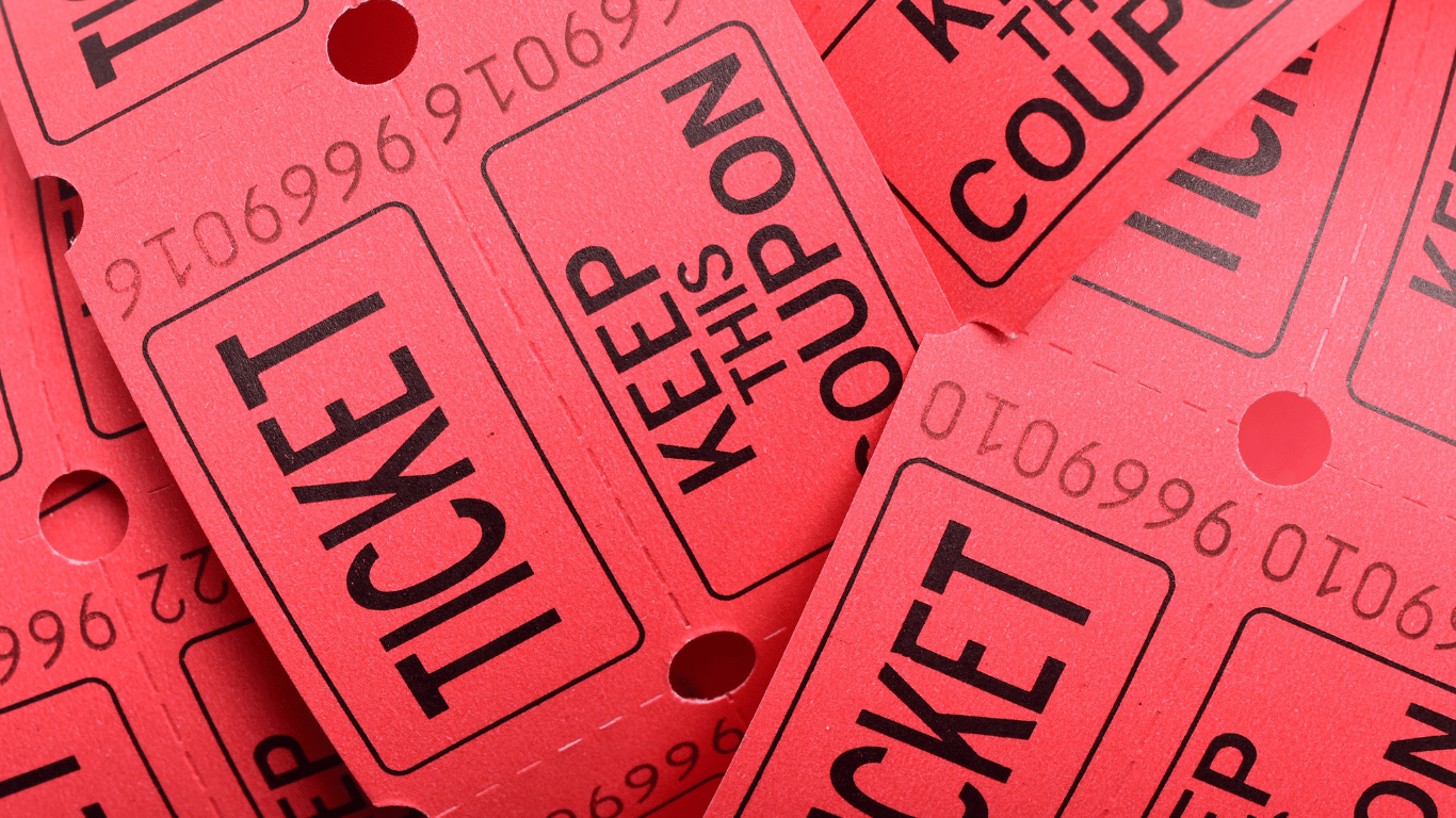 a person holding a lottery ticket