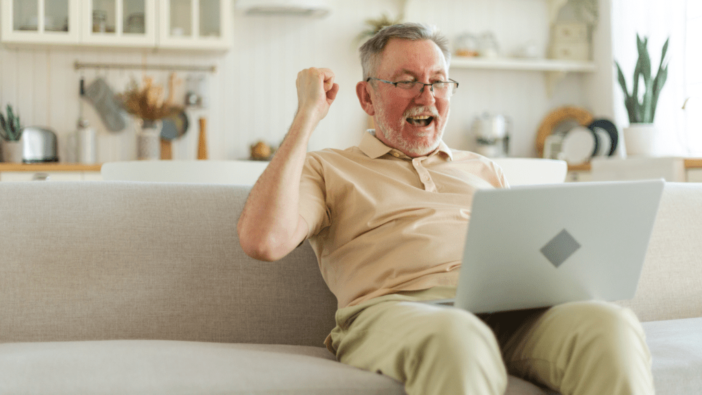 A-person-sitting-on-a-couch-with-a-laptop-1024x576